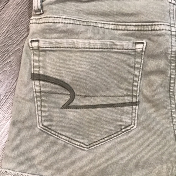 American Eagle “Hi-Rise Shortie” Light Olive Green Distressed Denim Shorts - Picture 3 of 7